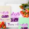 Thanx a Lotl Mockup 2 The “Thanxalotl” printable greeting card displayed in four print sizes — A5, A6, Half Letter, and 5x7 — on examples of A4 and US Letter paper.