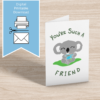 Hand-drawn printable greeting card with a cute koala holding a cup of tea and the pun “You’re Such a Koala Tea Friend.”